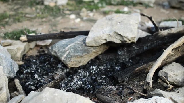 Extinguished campfire.Old firecamp.Place ready for fire..