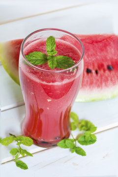 fresh  watermelon drink smoothie with mint on white table