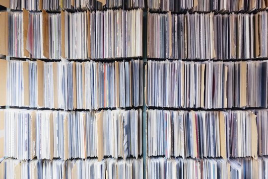 Full frame shot of records in shelves at office
