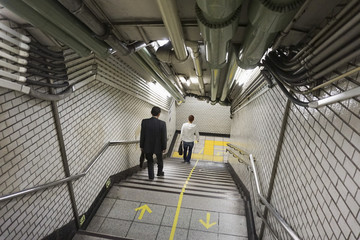 High angle view of people moving downstairs at subway station
