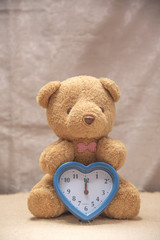 Teddy bear with clock