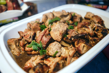 Marinated shish kebab cooked on a grill-barbecue and laid out in marmite.