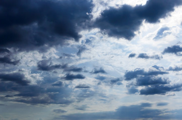 A blue sky with storm clouds. Before the rain.;