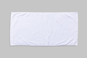 White beach towel mock up isolated with clipping path on grey background, flat lay top view