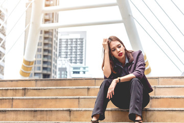 Fototapeta premium Unemployed businesswoman sit on stair