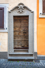 Antique classic old wood gate at Rome, Italy.