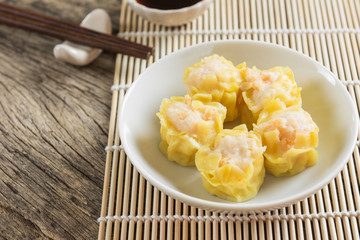 shrimp shumai-type of steamed dumpling, dim sum. popular chinese food appetizer, close up