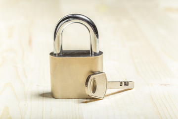 check-lock on the wooden table background