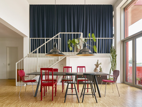 Pendant lights hanging over dining table at home