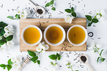 Green tea with a jasmine in white cups
