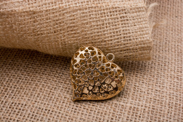 Heart shaped gold color metal object