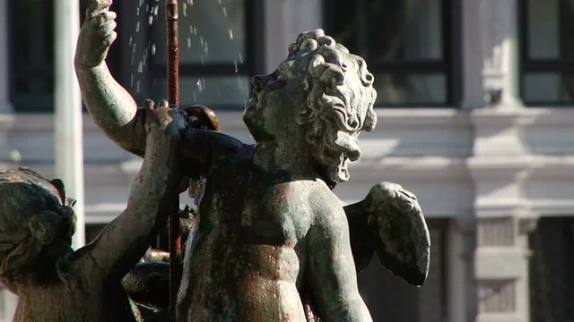 Close up of small fountain featuring children on Plaza Independencia in Montevideo, Uruguay 