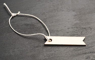 Empty label with rope on black background. Mockup.