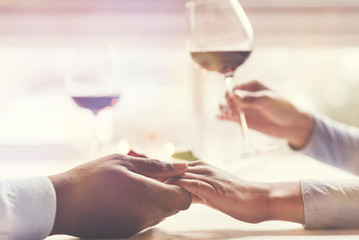 Selective focus of hands being held together