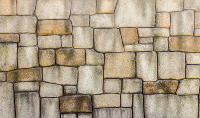 Stone wall texture background, pattern natural color of modern style design decorative uneven cracked real stone wall surface with cement