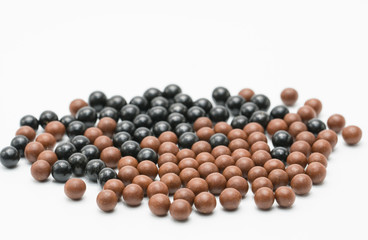 Thai herbal medicine pills spread on white background, bolus