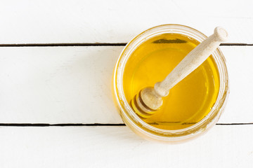 Jar of honey on the table./Jar of honey on the table 