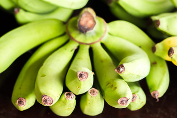 Fresh bananas on wooden background in the fruit market,Healthy food, bananas rich in vitamins, healthy lifestyle and prevention of vitamin deficiency.