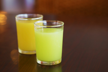 guava juice and orange juice on table