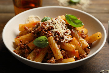 Pasta bolognese with basil leaves