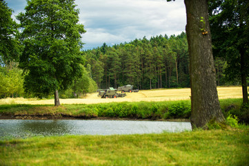 Combine harvester agriculture machines harvesting golden ripe wheat field. Agriculture concept