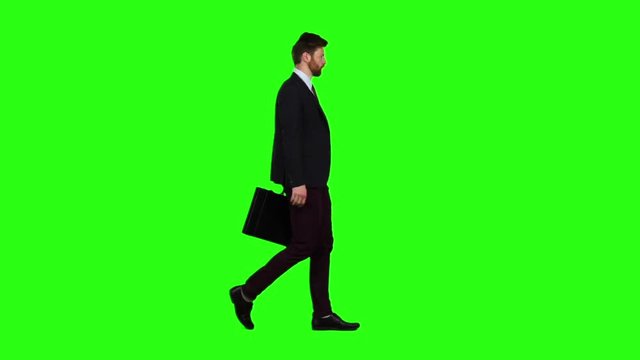 Businessman in the hands of a diplomat, he waves to people. Green screen. Slow motion