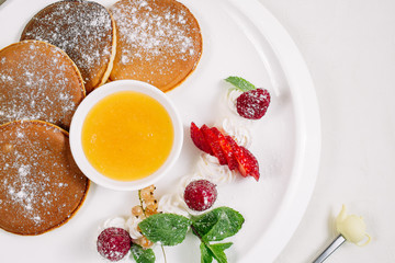 Cottage cheese pancake like bear, selective focus. Shot for a story on homemade, organic, healthy baby foods.