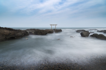 Fototapeta na wymiar Long exposure of Isosaki shrine torii gate at sea in Oarai, Ibaraki Prefecture, Japan