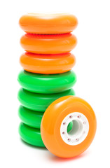Orange and green wheels isolated over white