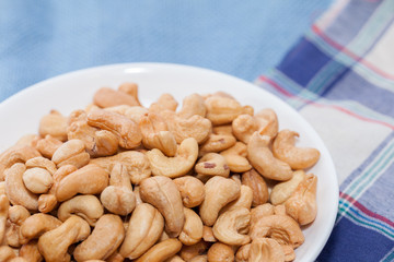 stack of Cashews on bowl