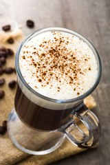 Irish coffee in glass on wooden table
