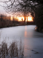 Frozen river in the sunrise