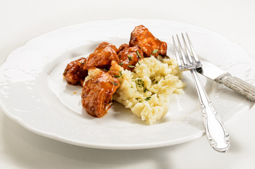 hungarian style chicken goulash with dumplings on a plate