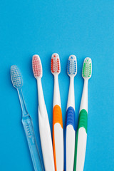 Photo of five colored toothbrush