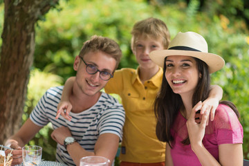 Fototapeta premium Three members of the same family posing for a photo