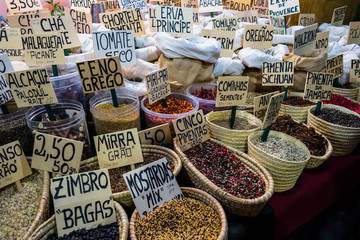 Baskets of spices at stall in street market