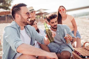 Group of friends having fun at the beach