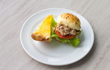 Mini Tuna Burger with coconut pie on white plate.