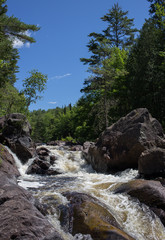 Fototapeta na wymiar Water cascade with big rocks