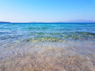 Seacoast of Cheshme Turkey. Blue seascape with light waves