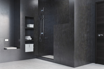 Black bathroom with a shower, closet