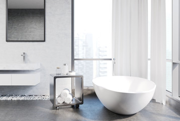 White and concrete bathroom, tub