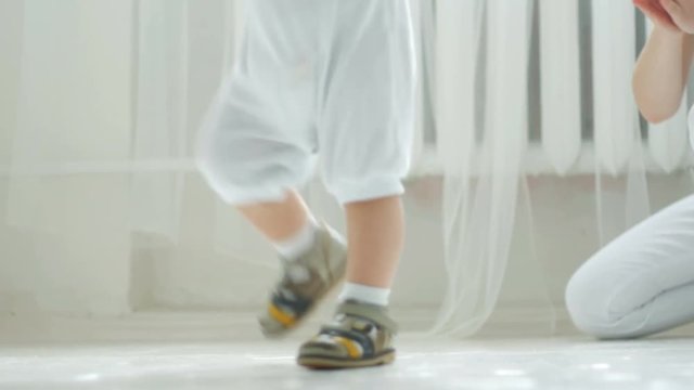 Young Child Taking First Steps