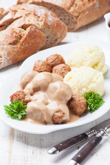 Traditional meatballs with sauce and mashed potatoes