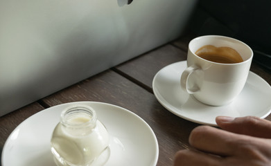 coffee and milk on table wood background