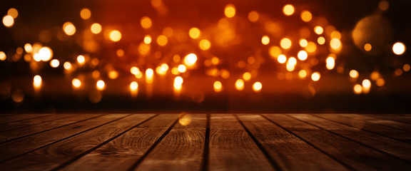 Red glowing bokeh background with wooden table