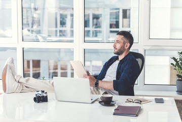 Pensive stylish guy is thinking about future