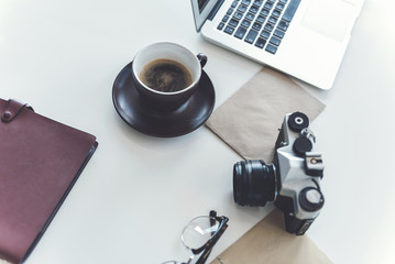 Modern gadgets with beverage are on desk