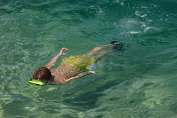 Boy diving with a mask