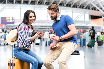 Happy smiling people waiting for flight